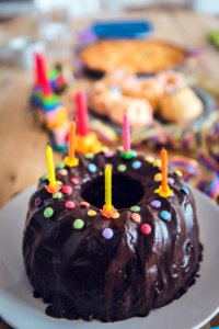 black cake with candles photo