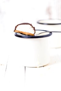 chocolate biscuit in white mug photo