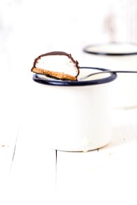 chocolate biscuit in white mug