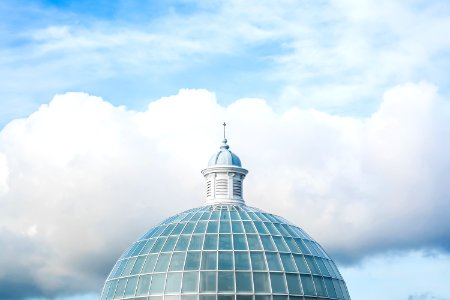 green and white dome tower under white and blue sky at daytime