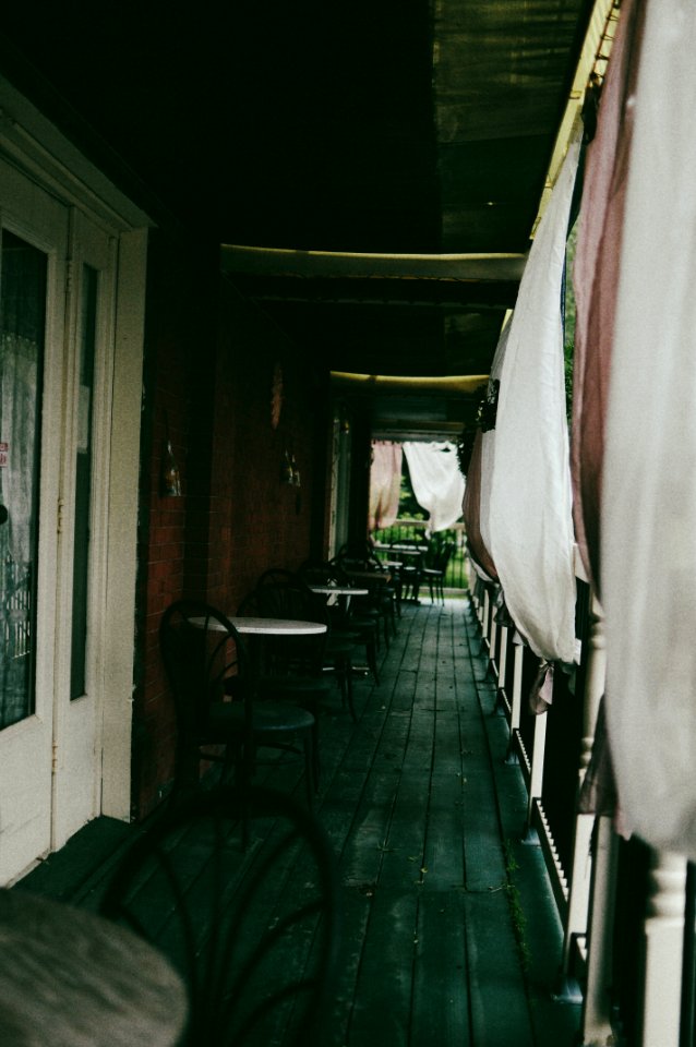 black chairs and round white table beside walls