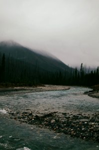 river under white sky photo