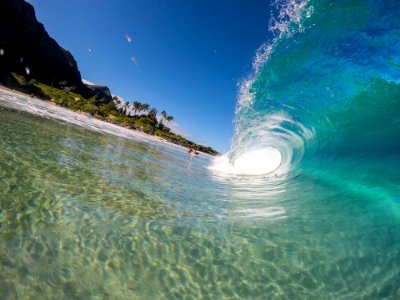 A transparent wave coming in near the shore. photo