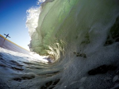 A macro shot of a wave, showing it flow overhead. photo