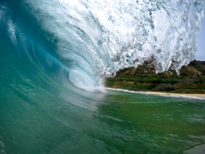 A macro shot of an incoming wave. photo