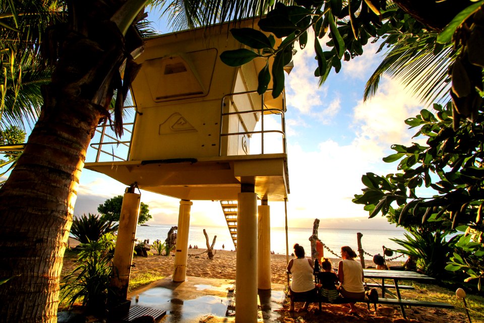People at a Hawaii beachfront location.