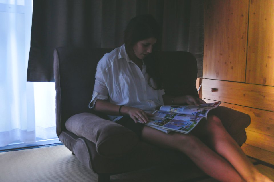woman siting while reading