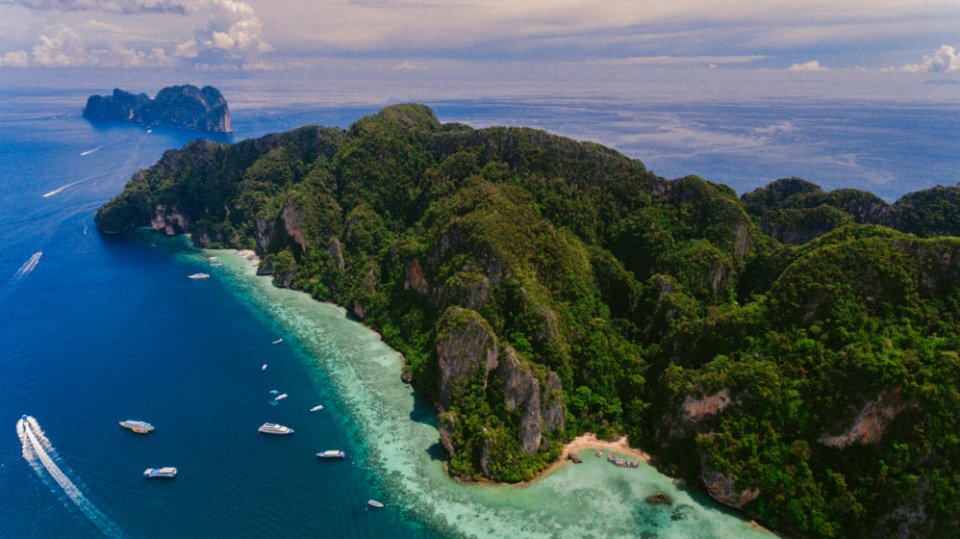 aerial photography of island under blue sky photo