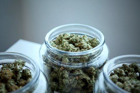 clear glass jar filled with kush photo