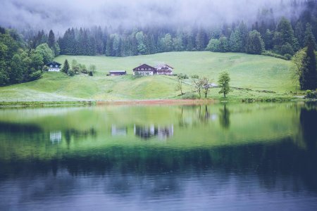 brown house near body of water photo