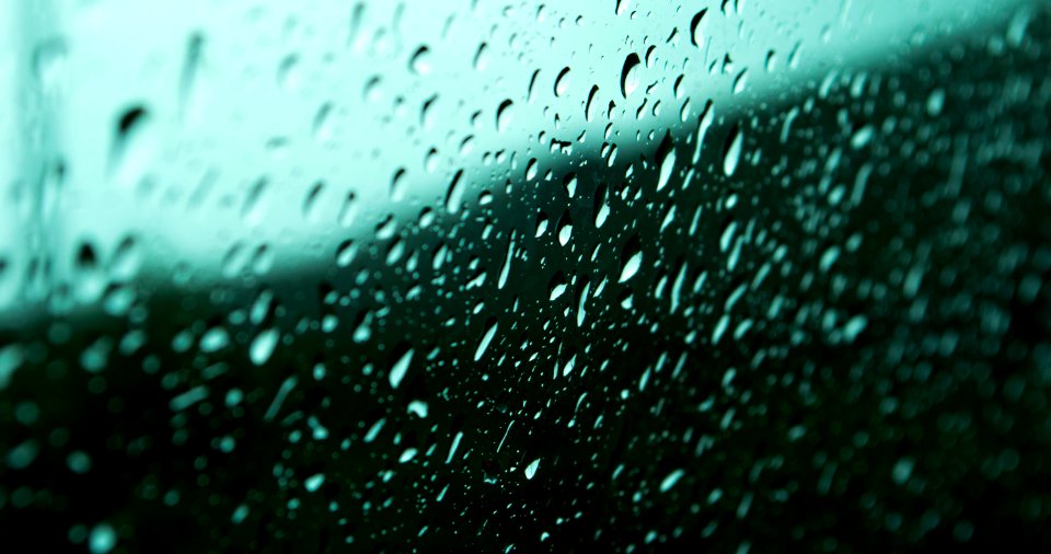 macro photography of droplets on glass photo