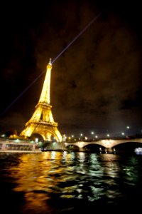 A night-time shot of the brightly lit Eiffel Tower in Paris. photo