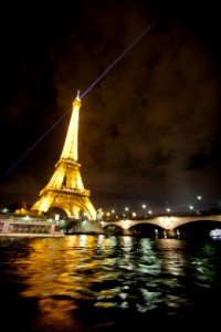 A night-time shot of the brightly lit Eiffel Tower in Paris.