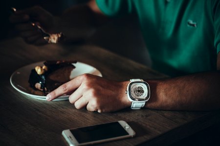 person holding stainless steel fork photo