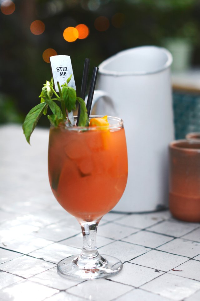 wine glass with juice in shallow focus photography
