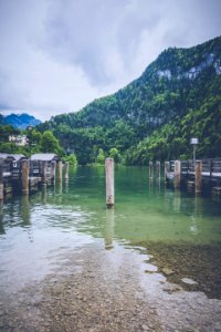 white post on body of water
