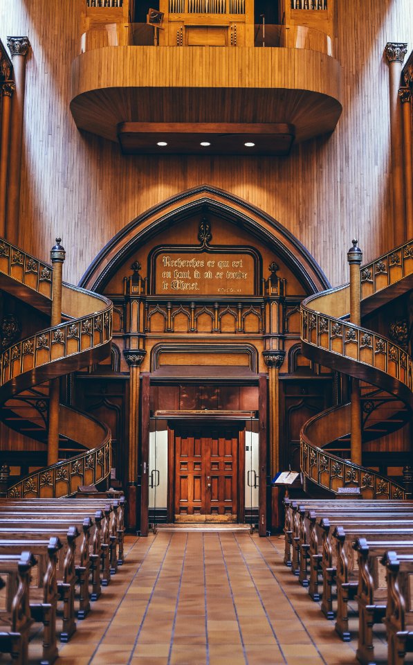 brown wooden pews inside church
