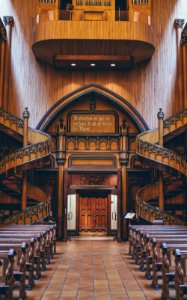 brown wooden pews inside church photo