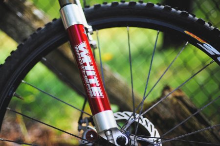 white brothers sticker on red bicycle telescopic photo