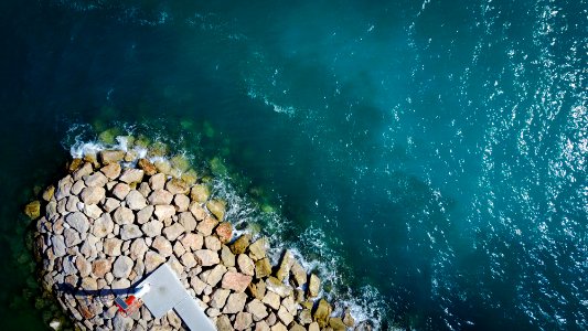 aerial view of rocks beside body of water photo