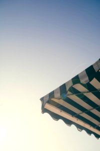 white and green striped umbrella photo