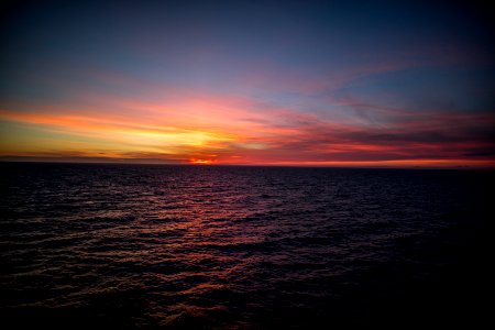 landscape photo of body of water during golden hour photo