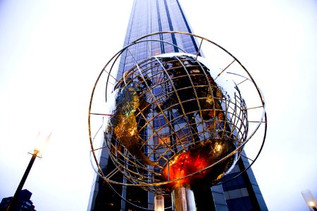 low-angle photography of globe statue photo