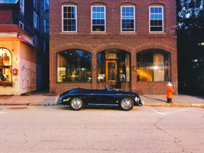 convertible parked outside store