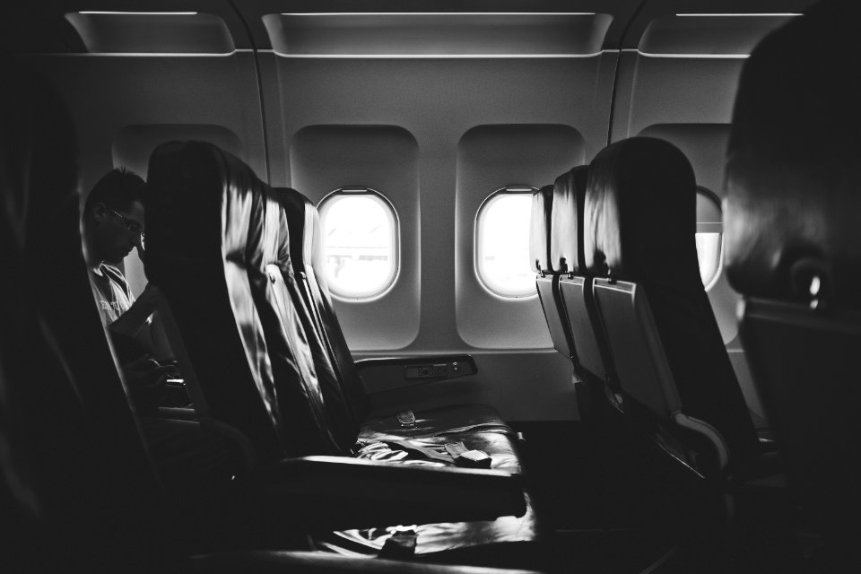 grayscale photo of airplane seats