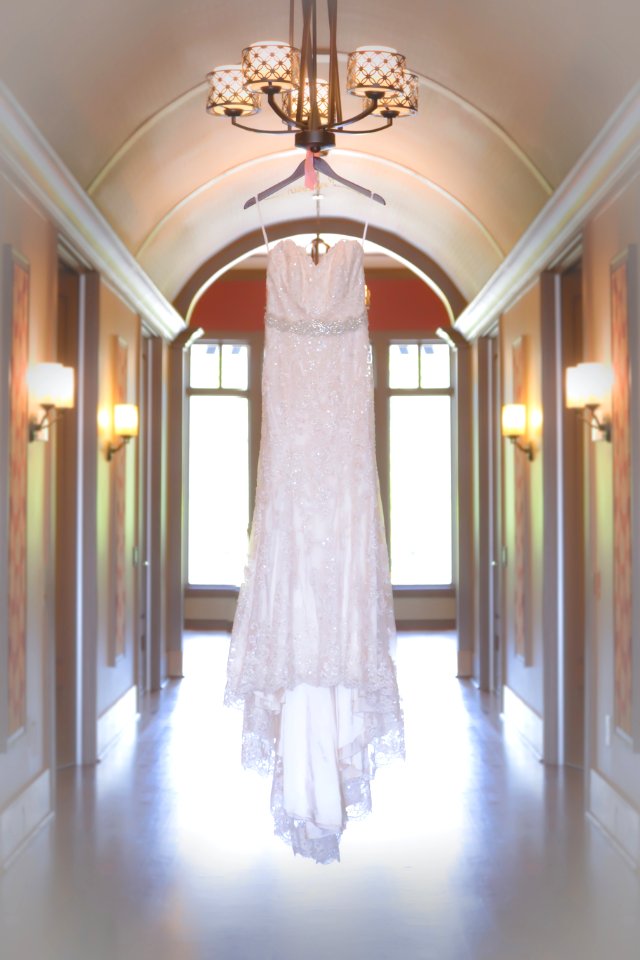 white spaghetti strap dress hang on chandelier