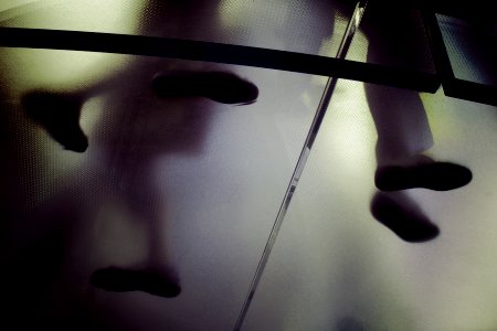 person standing on frosted glass flooring photo