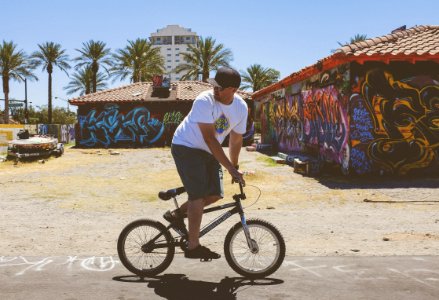 man using black BMX bicycle photo