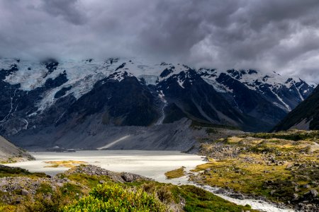 landscape photography of mountain under cloudy sky during daytime photo