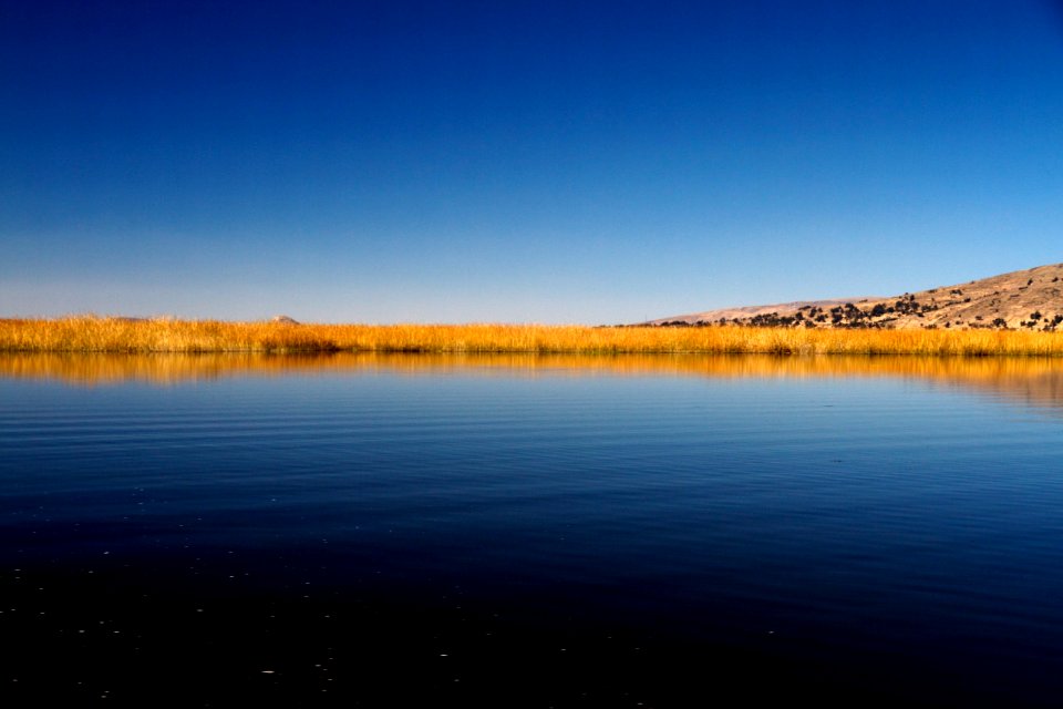 body of water near mountain
