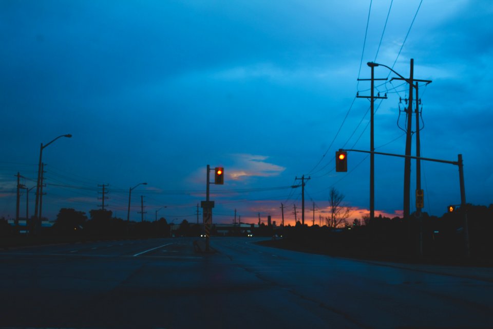 low light photography of concrete road