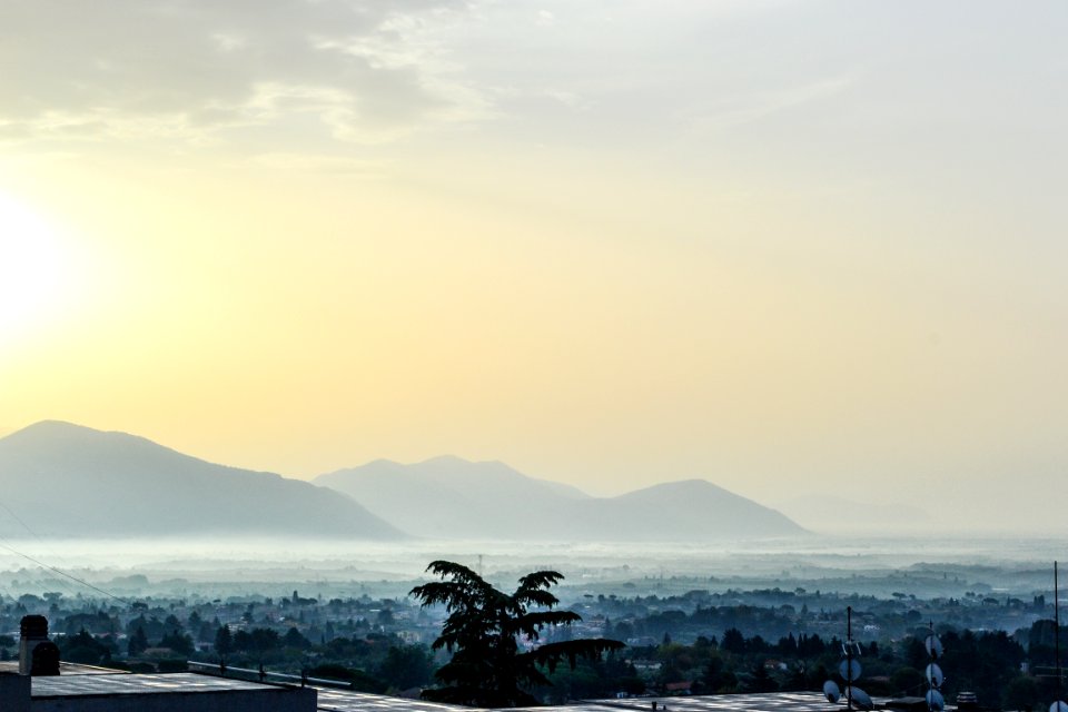 fog covering the mountains and city