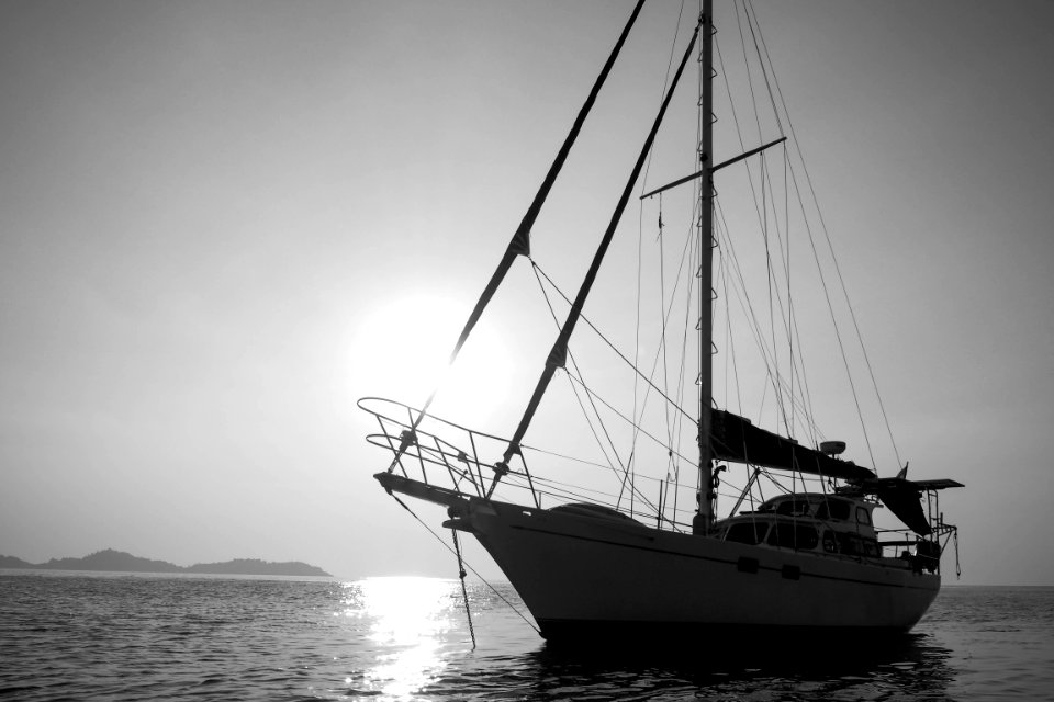 white yacht on body of water