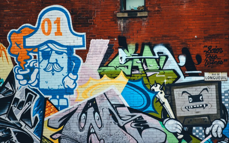 A graffiti painting of a character shaped as a TV.