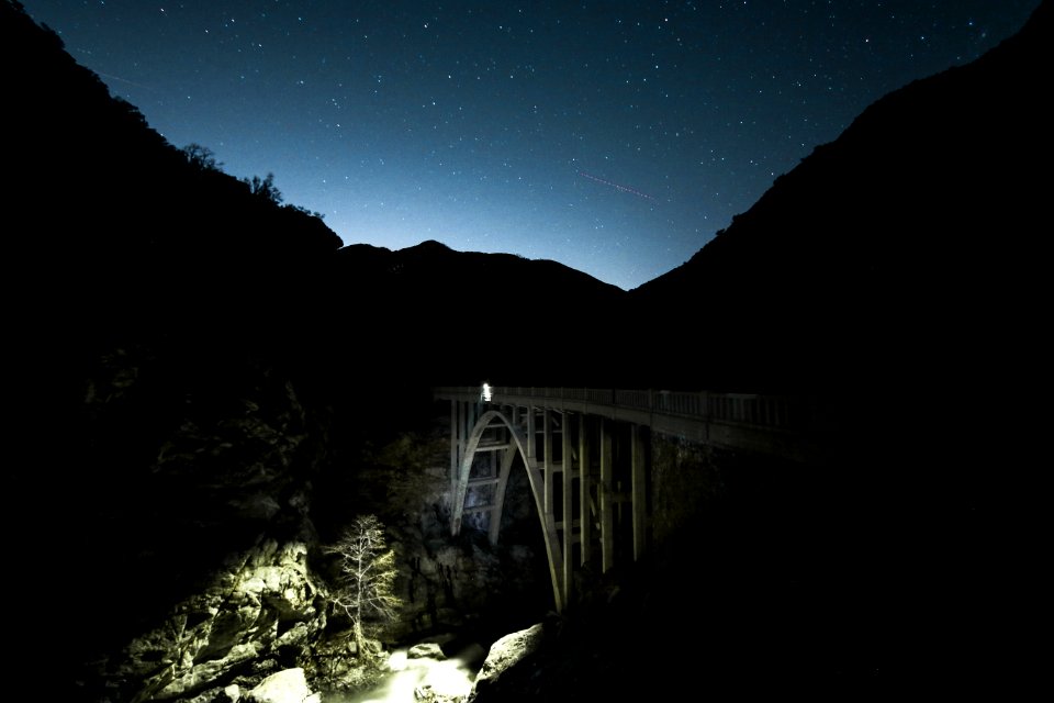 gray bridge under night sky