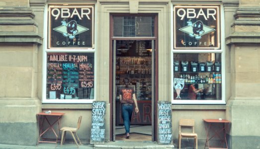 Newcastle, Woman walking into 9bar, United kingdom
