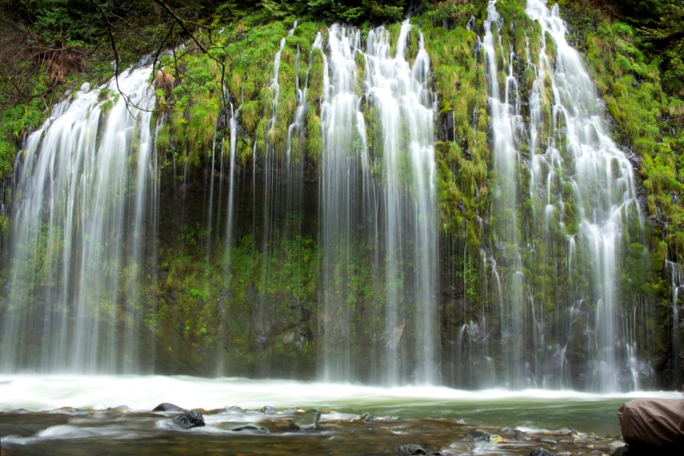water falls with rocks and trees