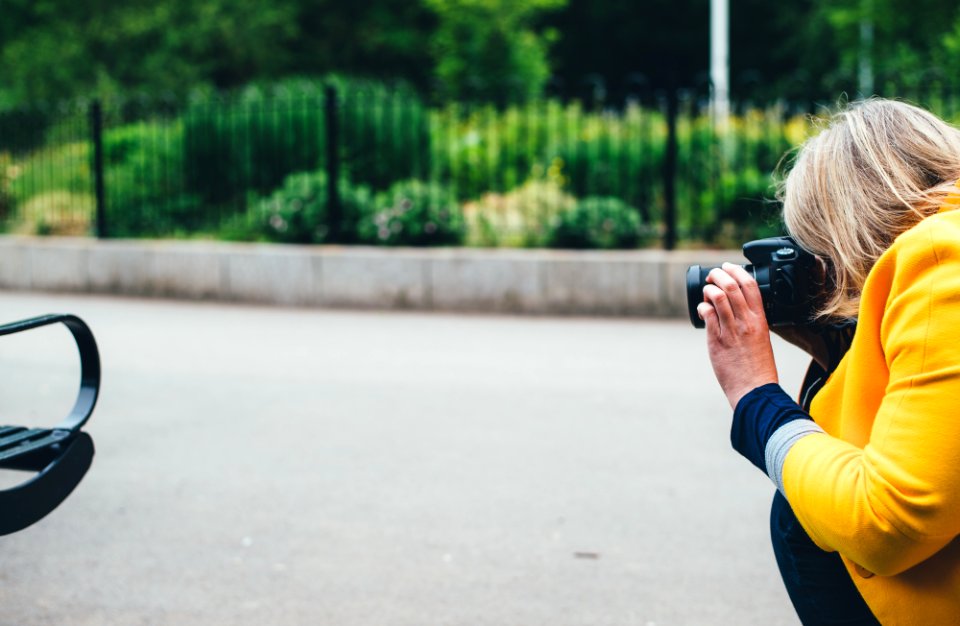 woman taking photo of vehicle photo