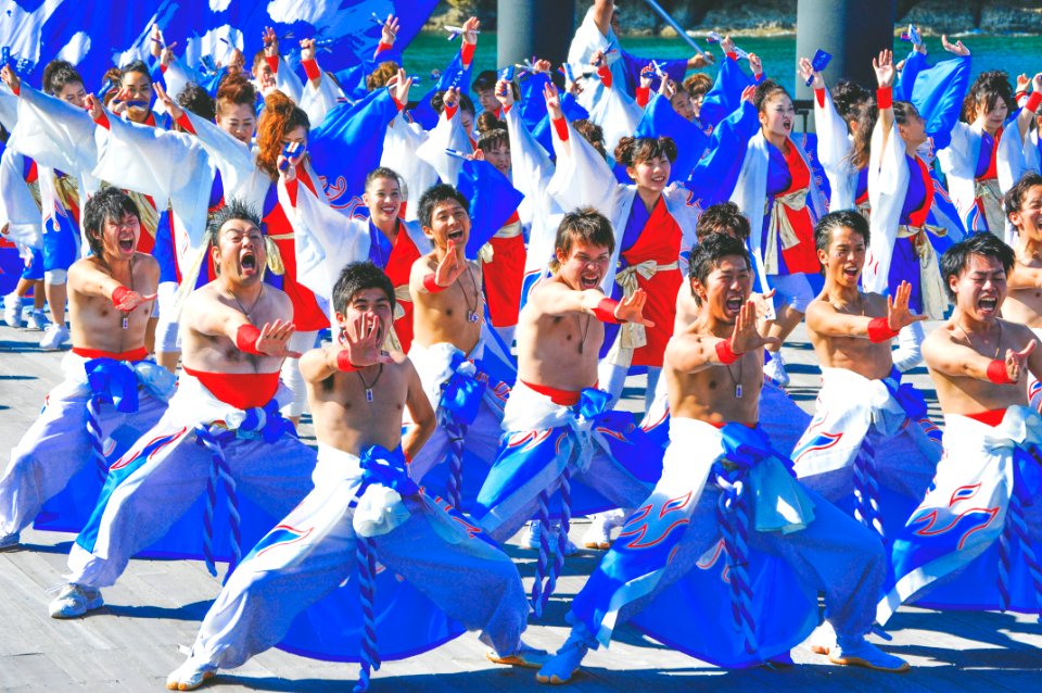 group of men dancing on street photo