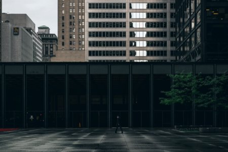 person walking near building during daytime photo