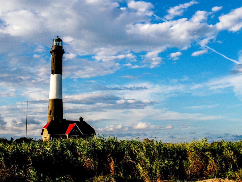 white and black lighthouse during daytime