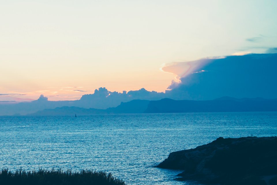 ocean near mountain
