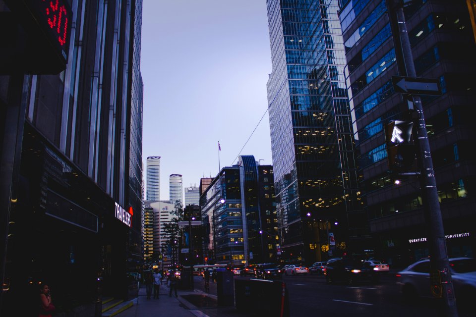 people walking around buildings photo