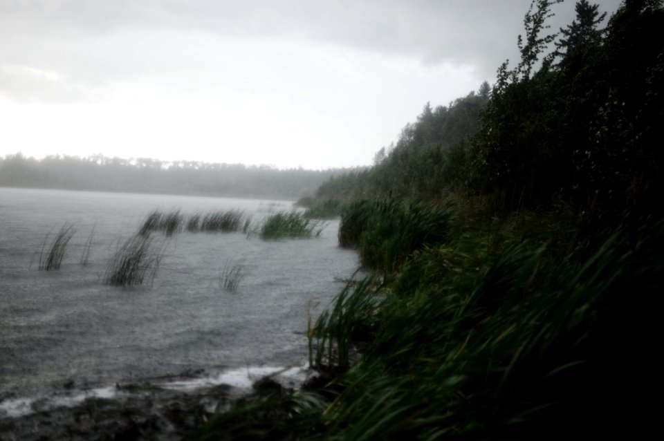 body of water under cloudy sky photo