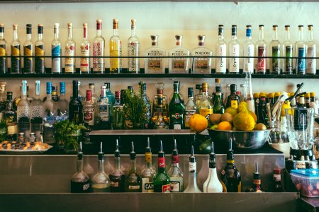 clear glass bottles on shelf photo