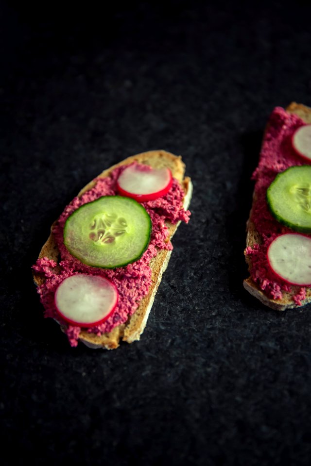 bread with sliced dragon fruit and cucumber on top
